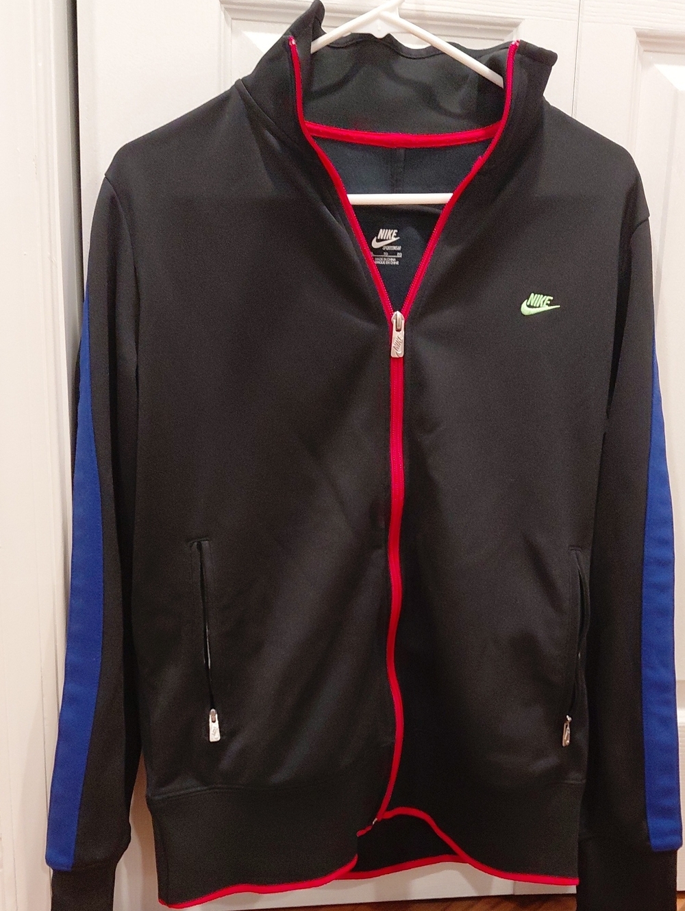 Nike Black Track Jacket with Blue Sleeve Panels and Red Trim